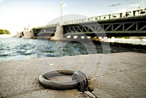 Mooring ring on stone embankment of the Neva river