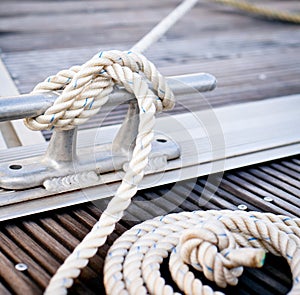 Mooring rope tied around steel anchor photo