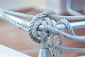 Mooring rope tied around steel anchor photo