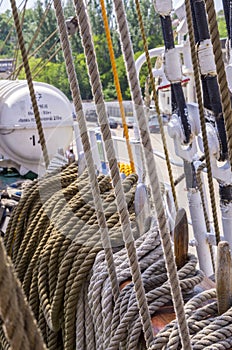 Mooring rope tied on the bollards of old wooden ship