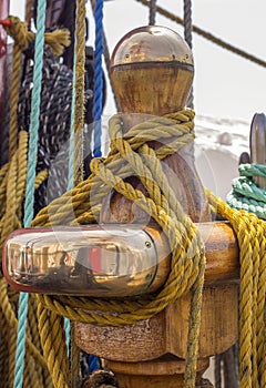 Mooring rope tied on the bollards of old wooden ship