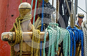 Mooring rope tied on the bollards of old wooden ship