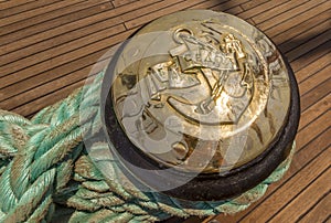 Mooring rope tied on the bollards of old wooden ship