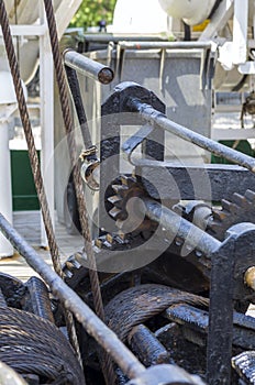 Mooring rope tied on the bollards of old wooden ship