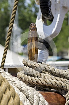 Mooring rope tied on the bollards of old wooden ship