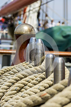 Mooring rope tied on the bollards of old wooden ship