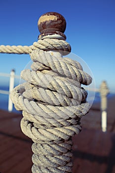 Mooring rope tied to a bollard on the dock