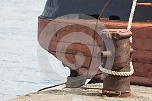 Mooring rope wrapped around bitts.