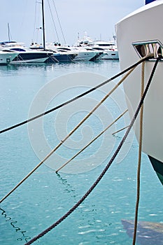 Mooring ropes against Mediterranean gree