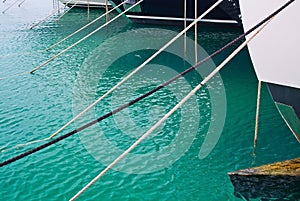 Mooring ropes against Mediterranean gree