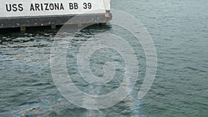 Mooring for the uss arizona and an oil sheen on the surface of the water