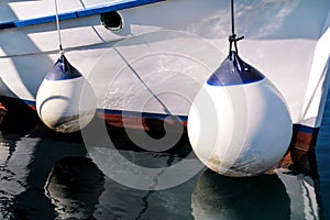 Mooring white buoys on fishing boat