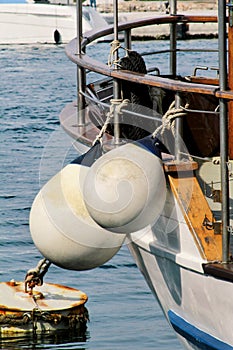 Mooring white buoys on fishing boat