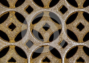 Moorish or Celtic design in repeating circular pattern made of rusted cast iron.
