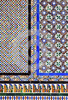 Moorish tiles on a wall in the Alcazar of Seville, Spain