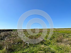 Moorland landscape, set against a blue sky near, Hawksworth, Leeds, UK