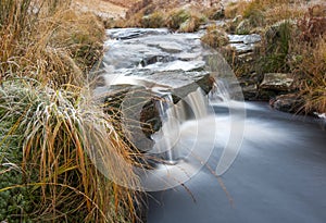 Moorland stream on icy morning