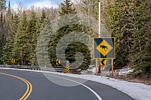 Moose crossing hazard road sign on rural highway
