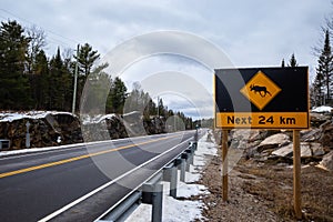 Moose crossing sign warns of hazard for next 24 km