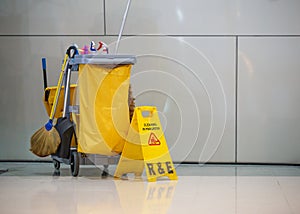 Mop bucket and caution sign