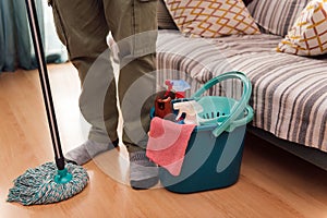 mop and a bucket with cleaning products