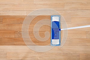 Mop cleaning a wooden floor