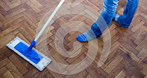 Mop cleaning a wooden floor photo
