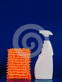 mop cloth and white bottle with reading agent on a blue background