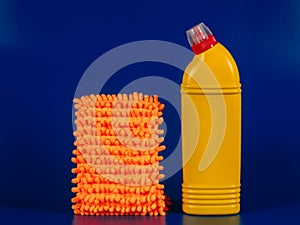 mop cloth and yellow bottle with reading agent on blue background