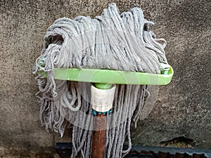 a mop that is often used by housewives to clean the floor