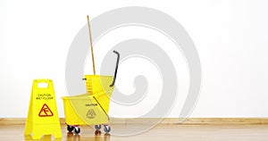 Mopping bucket with caution sign