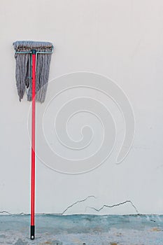 Mops cleaning equipment is placed on the wall