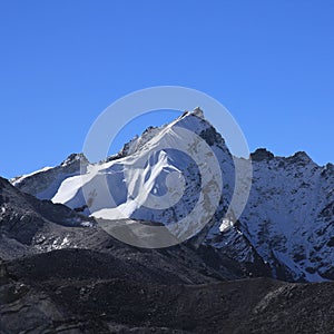 Moraine of the Khumbu Glacier and peak seen from Gorakshep