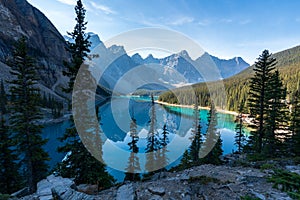 Moraine lake beautiful landscape in summer morning. Shadow moves on turquoise blue water with reflection. Canadian Rocki