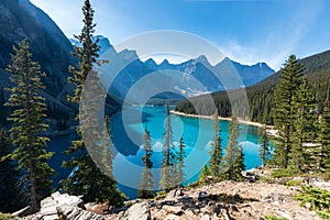 Moraine lake beautiful landscape in summer morning. Shadow moves on turquoise blue water with reflection. Canadian Rocki