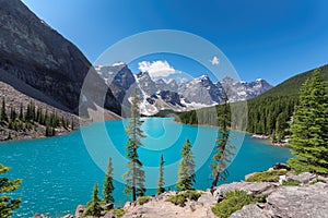 Moraine lake at sunny day, in Rocky Mountains, Banff National Park, Canada.