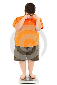 Morbidly Obese Fat Child on Scale photo