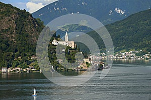Morcote, Switzerland - June 4, 2017: View over lake Lugano to town Morcote in Ticino, Switzerland and the Church of Santa Maria de photo