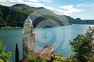 Morcote, Switzerland - October 6th 2021: View over the historic church to Lago di Lugano photo