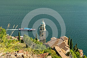 Morcote, Switzerland - October 6th 2021: View over the historic church to Lago di Lugano photo