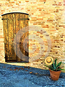 Moresco town in Fermo province, Marche region, Italy. Home, hat, grass plant and Italian style