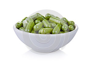 Moringa capsules in the bowl