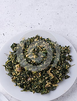 Moringa or drumstick leaves dish, tempered vegetarian dish, closeup