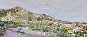 Green belt with vegetable gardens along the Sierra Grande hillside, Hornachos, Extremadura, Spain photo