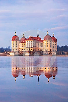 Moritzburg castle after sunrise at winter time, Germany