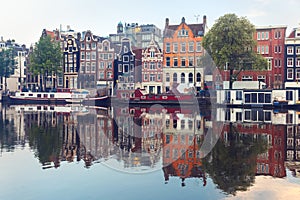 Morning Amsterdam canal with dutch houses