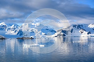 Morning in Antarctica, beautiful landscape of Lemaire Channel with small Chilean Station near Paradise Bay, Antarctica