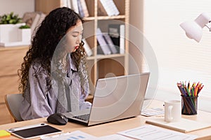 In the morning,Asian working woman on the desk with her laptop, working from home