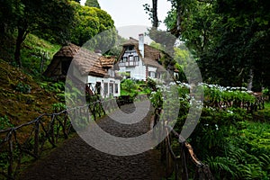 Morning atmosphere by the typical houses in Queimadas Forest Park in Santana, Madeira