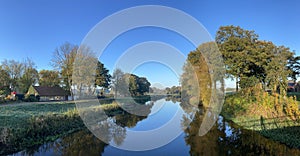 Morning autumn landscape panorama from the Beneden Regge river photo